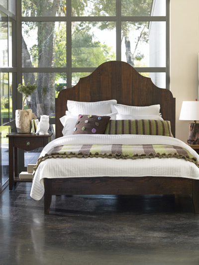 A simplified bedroom can reflect your unique style. With a quirky owl lamp, whimsical accent pillows, a living plant and bamboo bedding, this simple bedroom is filled with character.